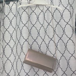 Rose gold shimmery clutch purse with strap